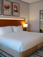 Premium Club Room with a large bed and modern decor at Warwick Hotel & Spa Jeddah.