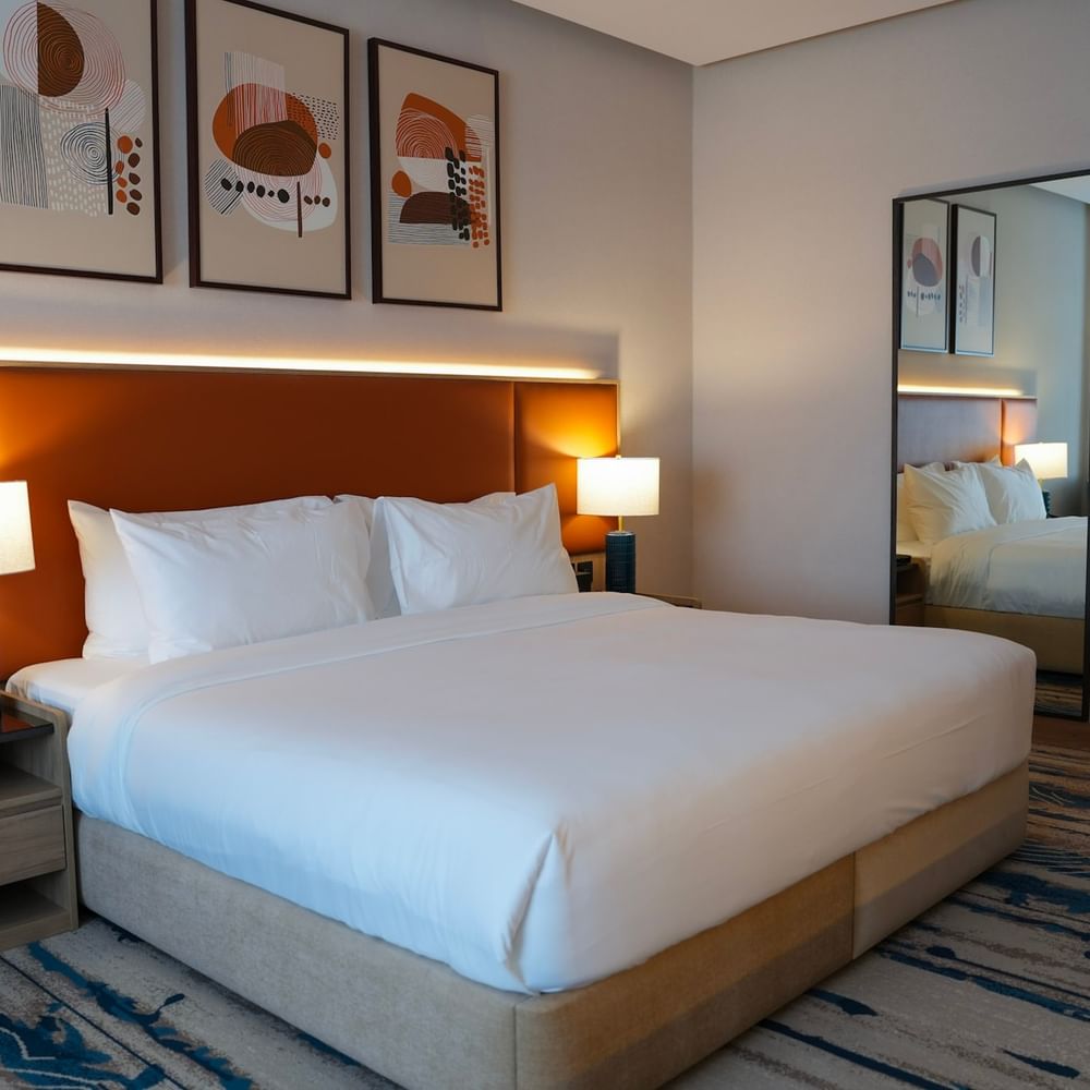Superior Room with large bed and modern decor at Warwick Hotel & Spa in Jeddah.