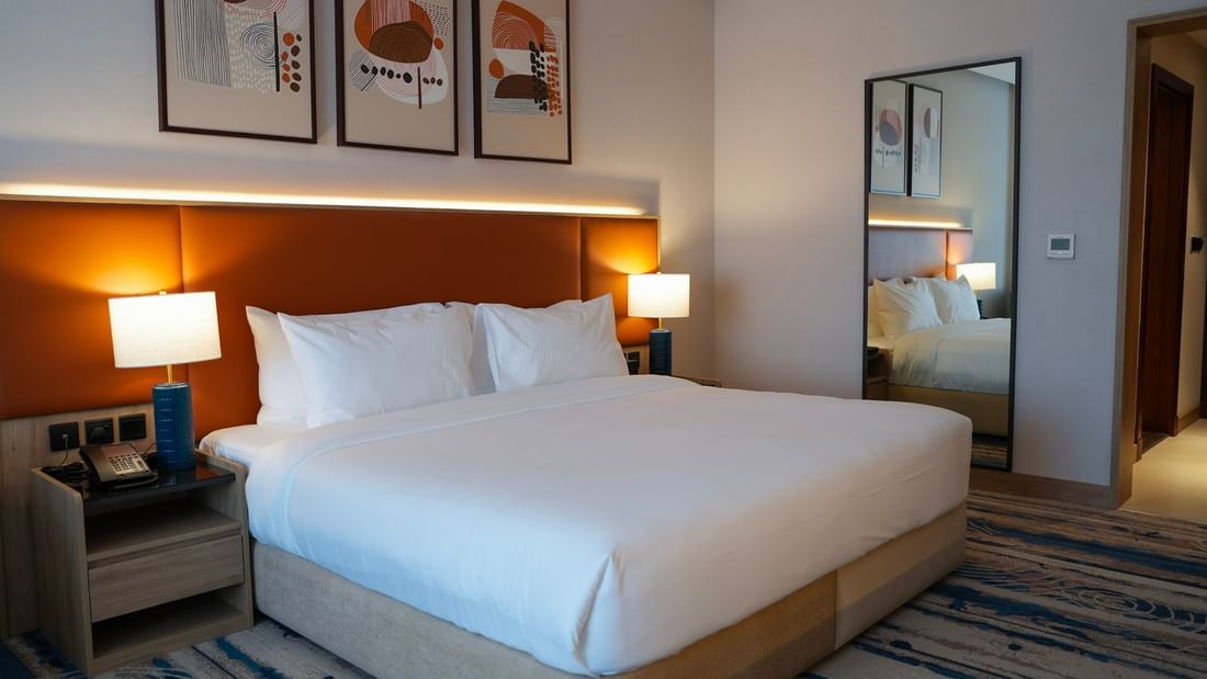 Superior Room with large bed and modern decor at Warwick Hotel & Spa in Jeddah.