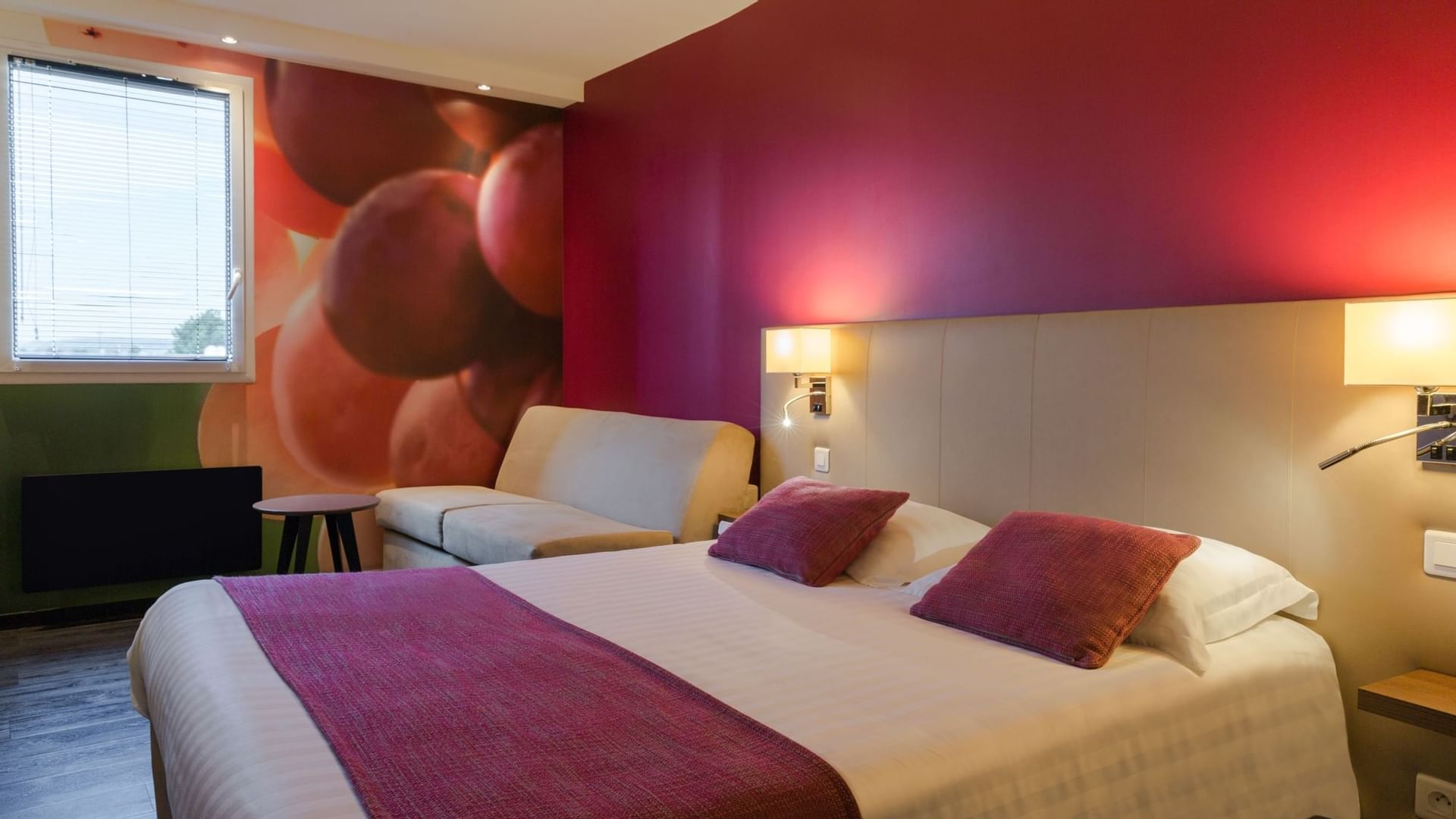 Double bed with red & white bedding at Originals Hotels