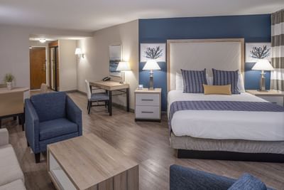 Bed and sitting area in the executive suite at Bay Club Hotel