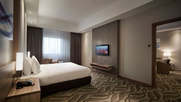 King bed with a TV in Executive Suite at Sunway Putra Hotel