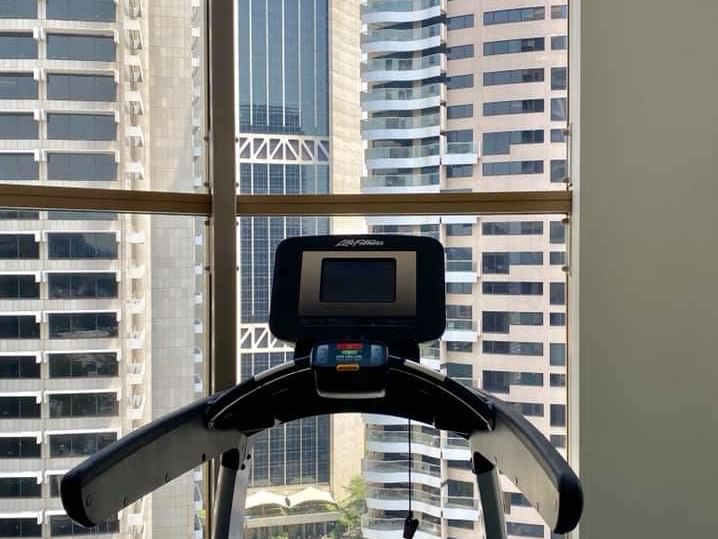 Treadmill of the gym at The Sebel Quay West Suites Sydney