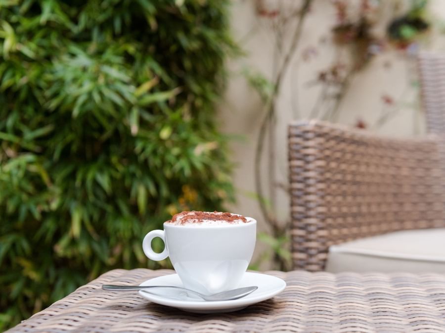 Closeup of a cup of coffee at Hotel Aux Vieux Remparts