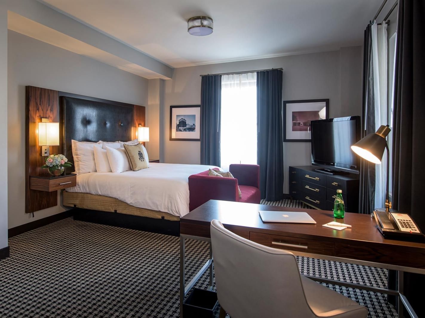Bed & working table with lamp in Luxury King at The Mayo Hotel