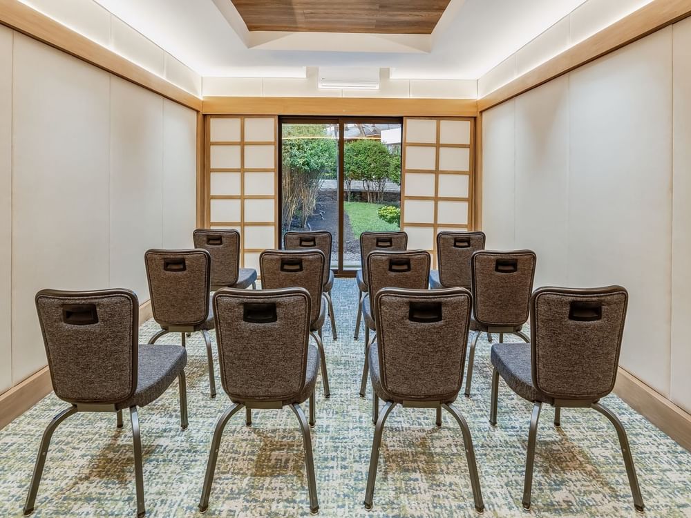 Comfortable chairs arranged neatly in Salon 9 meeting room at Grand Fiesta Americana