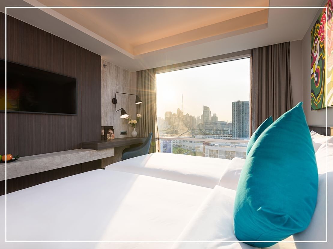 King bed of Grand deluxe room at Maitria Hotel Rama