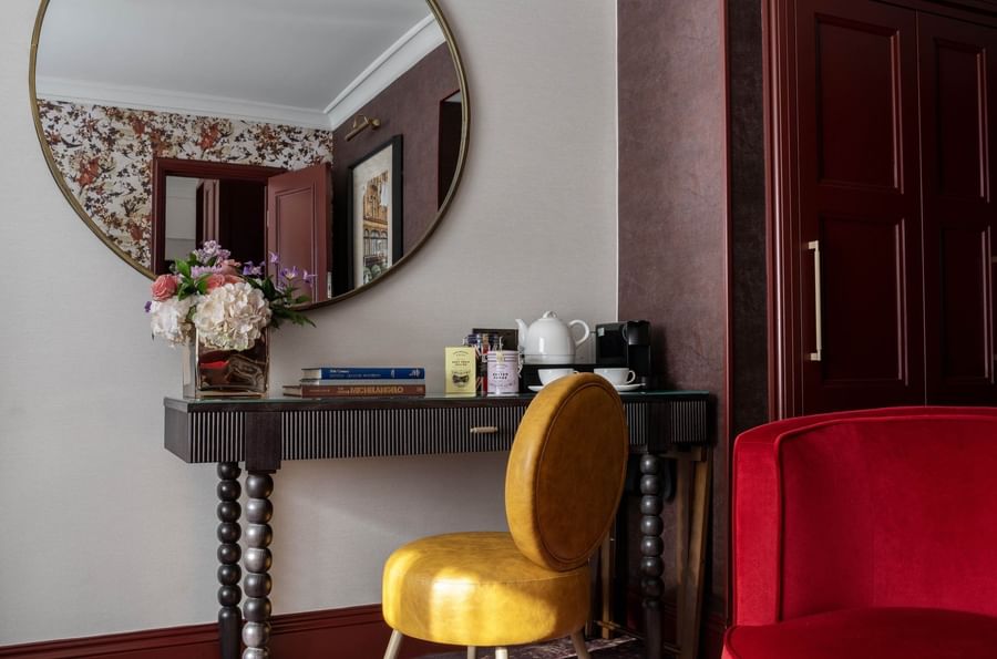 Vanity table with round mirror in Superior Room at The Capital Hotel, Apartments and Townhouse
