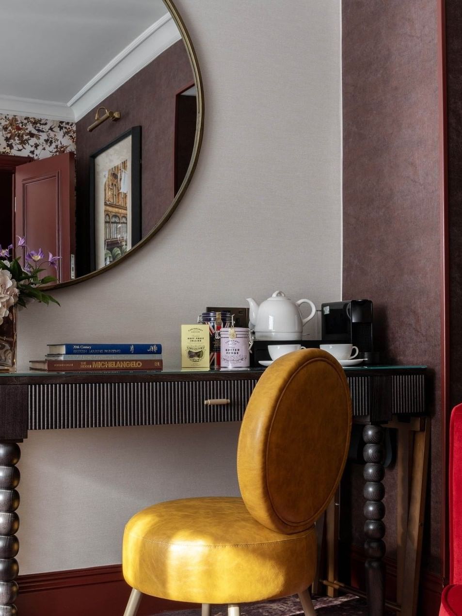 Superior Room decor with modern furniture and floral arrangement at The Capital Hotel, Apartments & Townhouse