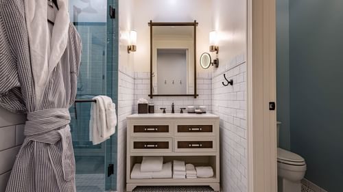 Bathroom vanity & shower area in Golf View Queen Room With Balcony at Camp Creek Inn