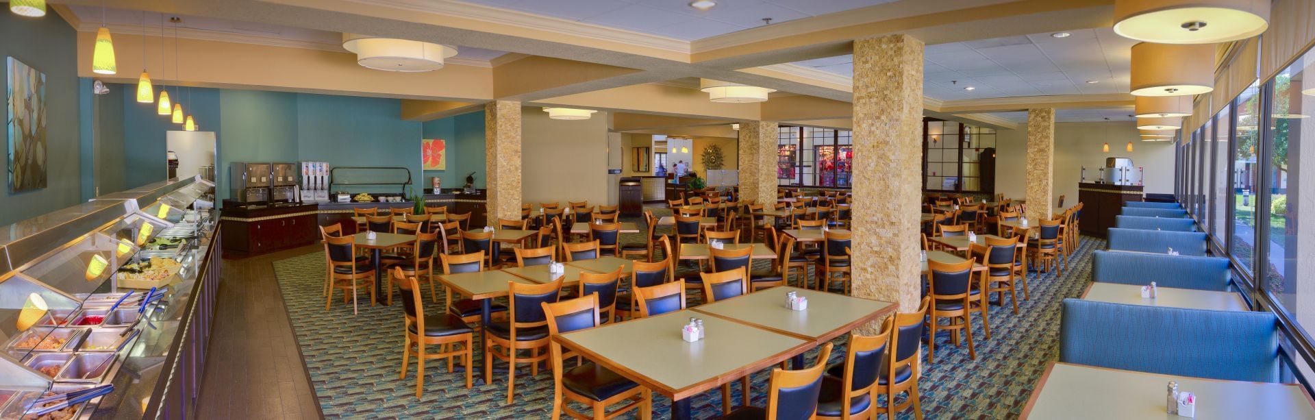 A large dining area with several tables and chairs.