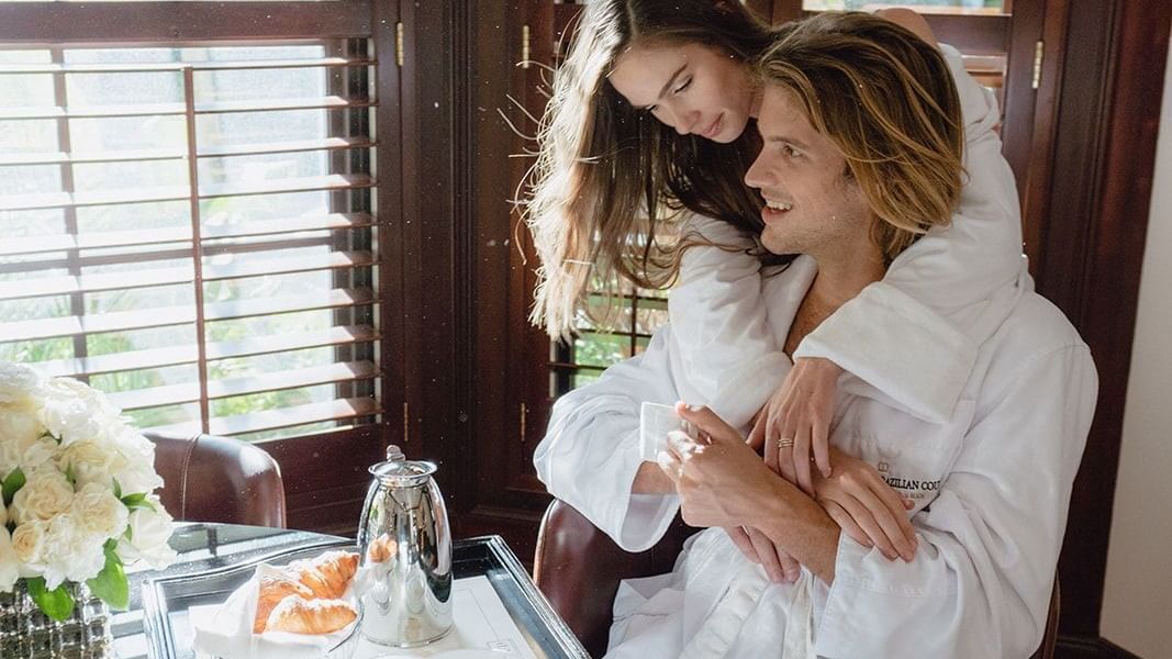 A couple having breakfast together at Brazilian Court
