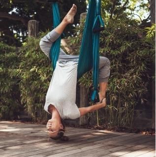 A woman is doing stretching workouts at Marbella Club