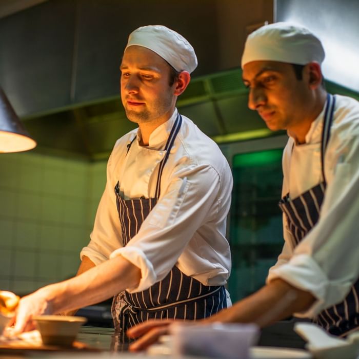 Close up on chefs preparing meal at Novotel Melbourne on Collin