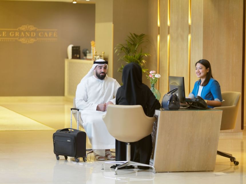 Guests at the reception counter of Two Seasons Hotel & Apt