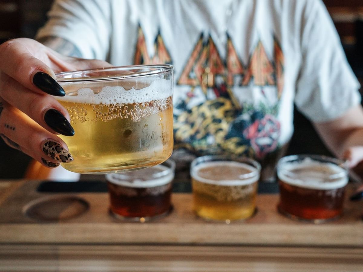 Person holding alcohol drinks