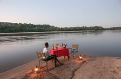 A Bush Dinner by the river at Serena Mivumo River Lodge
