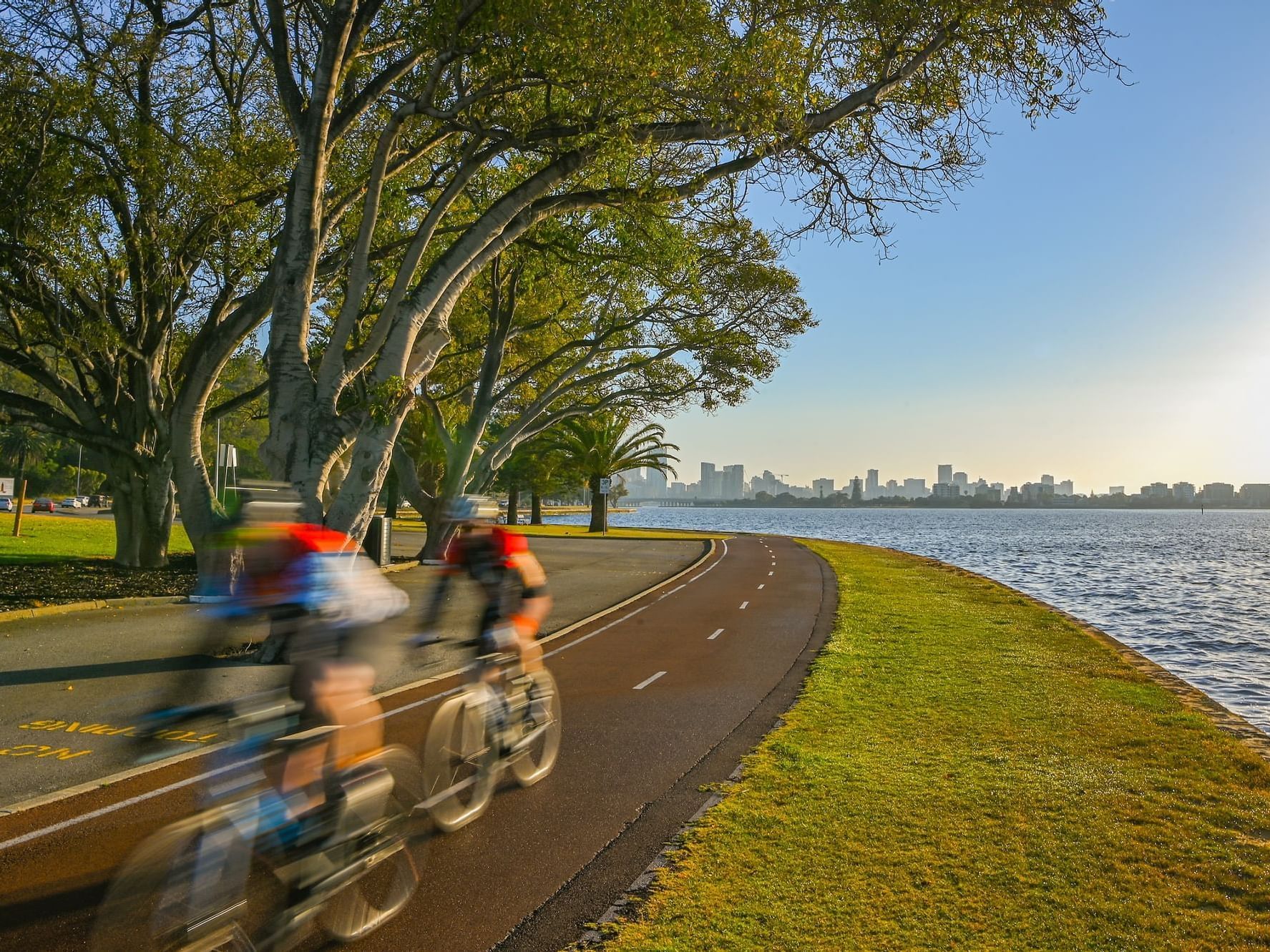 Bicycle trail by a lake & city view at Nesuto Mounts Bay