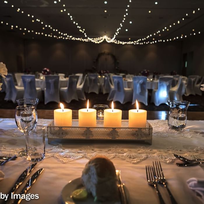 Wedding hall decorated with candles and lights at Mercure Kooindah Waters