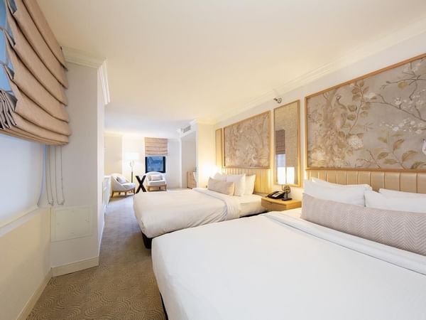 Renovated 2-Queen Beds Room with chairs at Warwick Allerton