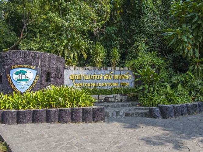 The entrance of Phlio Waterfall near Chatrium Golf Resort