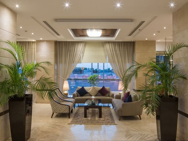 Elegant lobby area overlooking the outside view at Warwick Hotels and Resorts