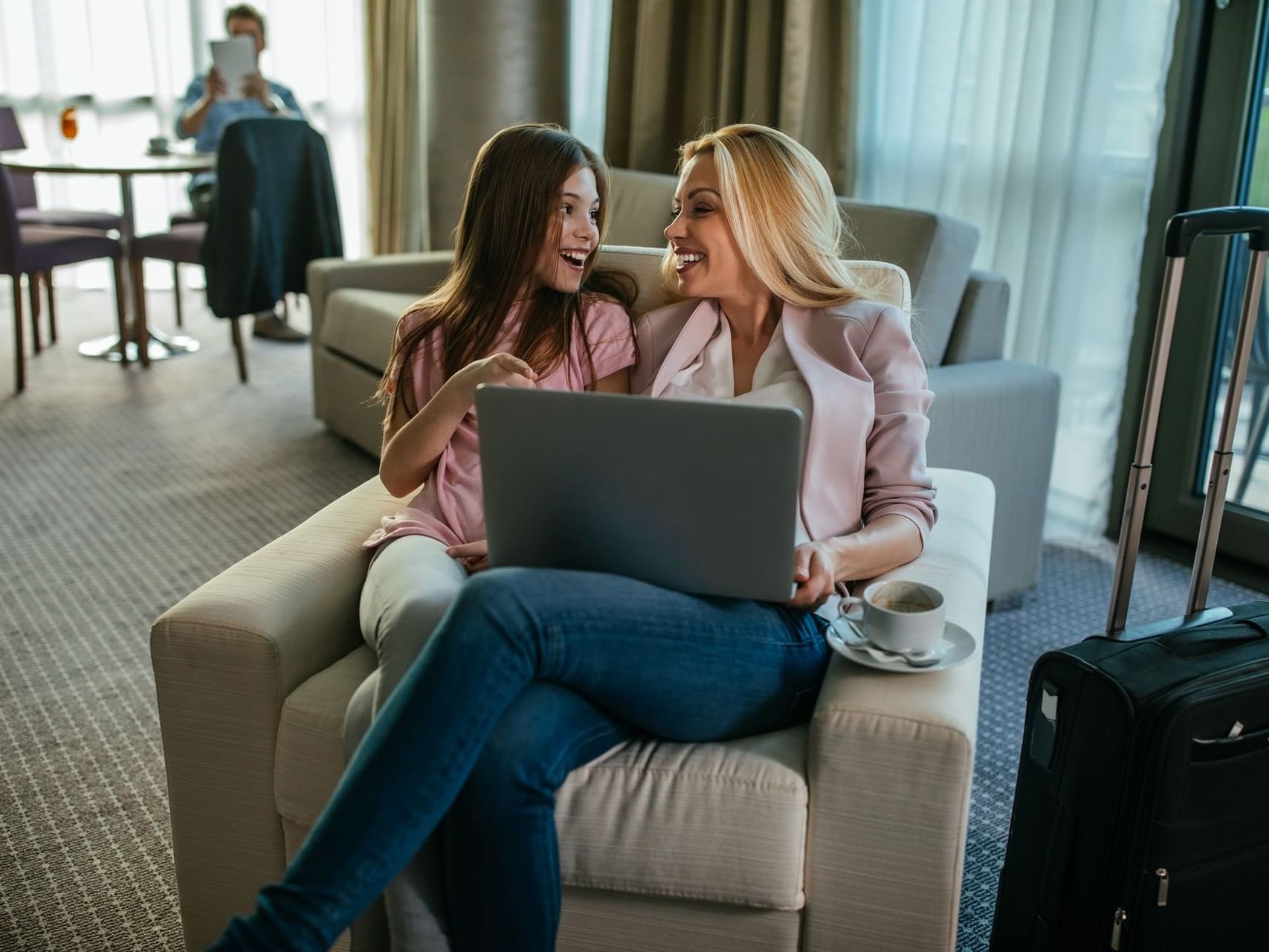 Mother & daughter sitting in a lounge area at Chase on The Lake