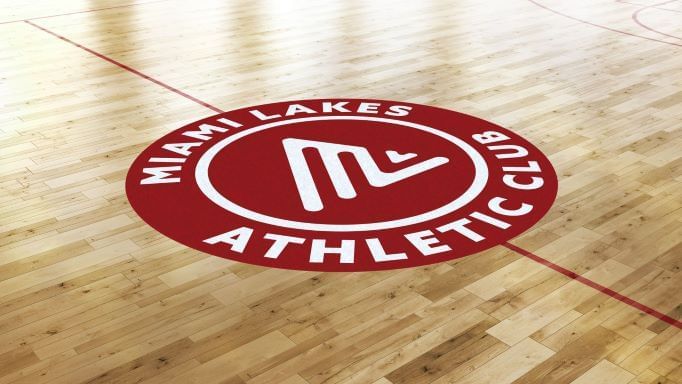 Close-up of Miami Athletics Club logo printed on the floor near Miami Lakes Hotel