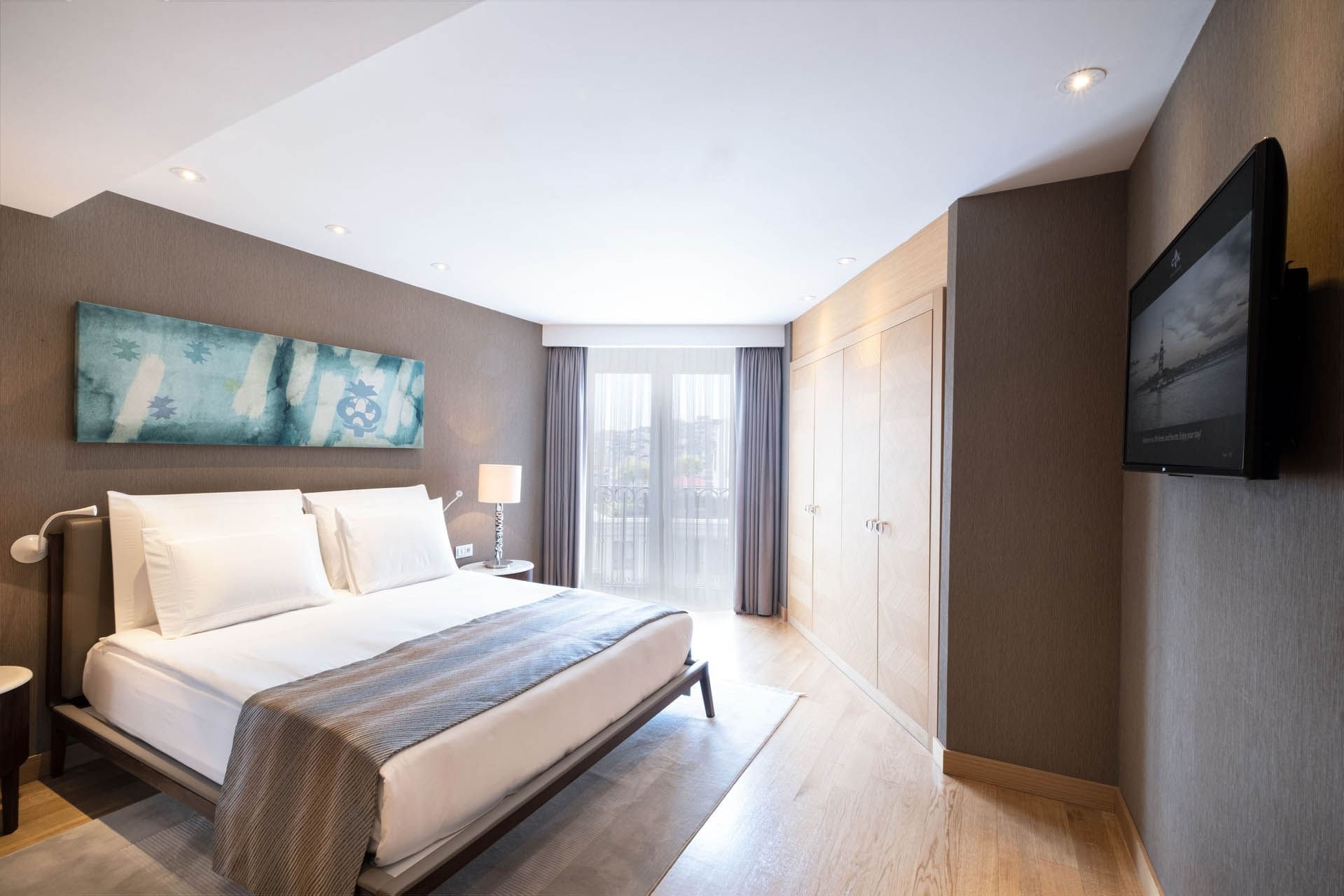 Two massage beds with a tray of amenities in Safira Spa & Fitness at CVK Park Prestige Suites Istanbul