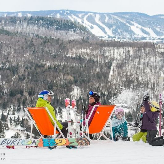 People ready to play snowy slope near Mont Gabriel Resort & Spa