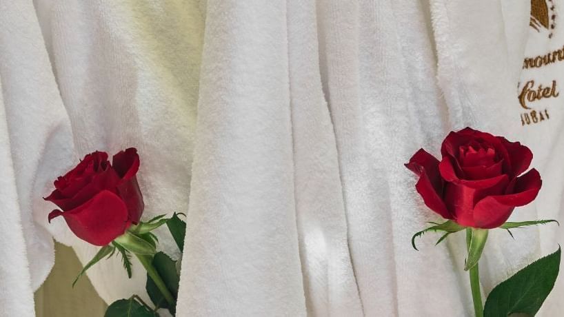 Close-up of rosses on a bathrobe, featuring Romantic Co-Stars Stay Package at Paramount Hotels