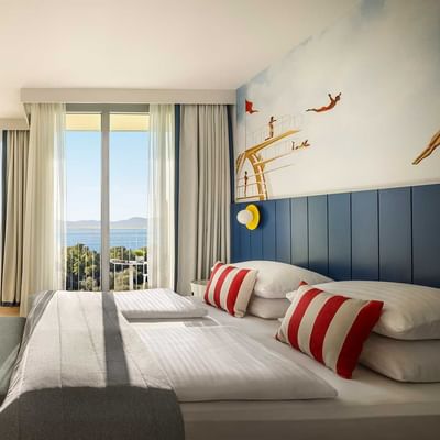 Bed in Falky Room Superior Seaside at Falkensteiner Hotels