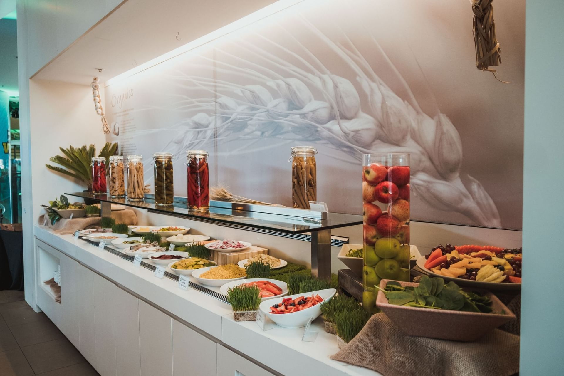 Display of delicious catered fresh salads, pickled vegetables & fruits jars at the buffet in Novotel Sydney Olympic Park