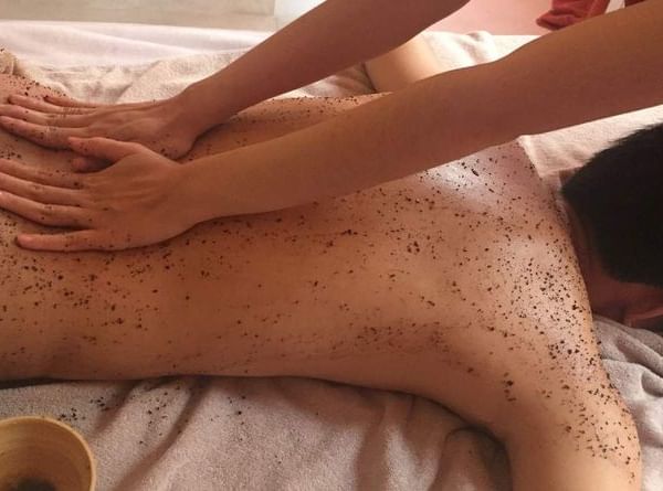 woman getting massaged in spa room