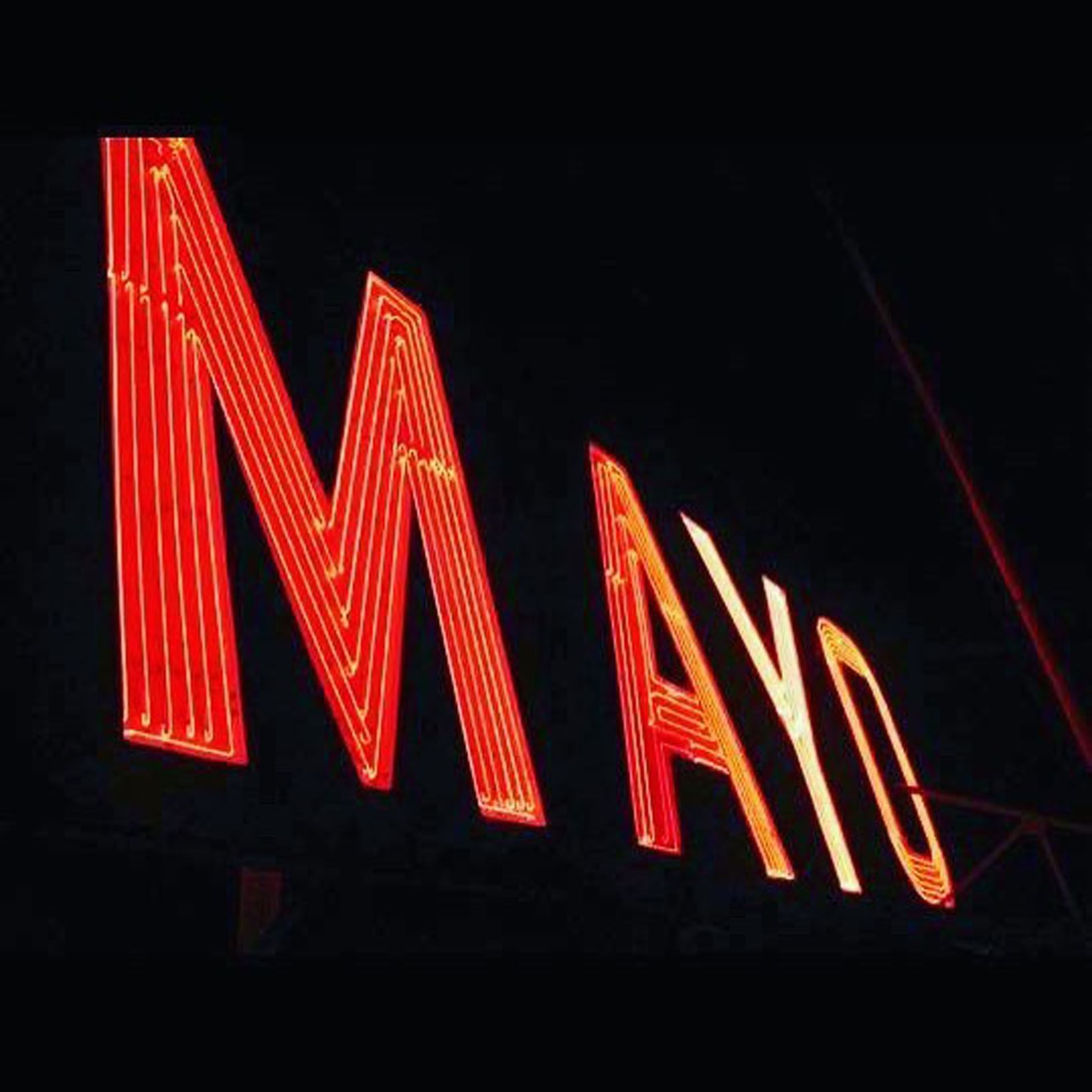 Close-up of hotel sign of MAYO at The Mayo Hotel at night