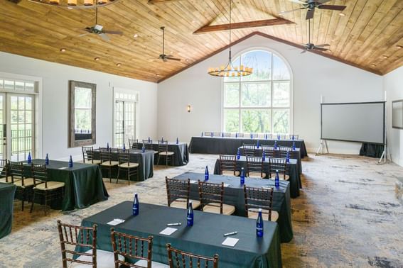 Meeting room with tables and chairs arranged in rows at the Inn at Willow Grove