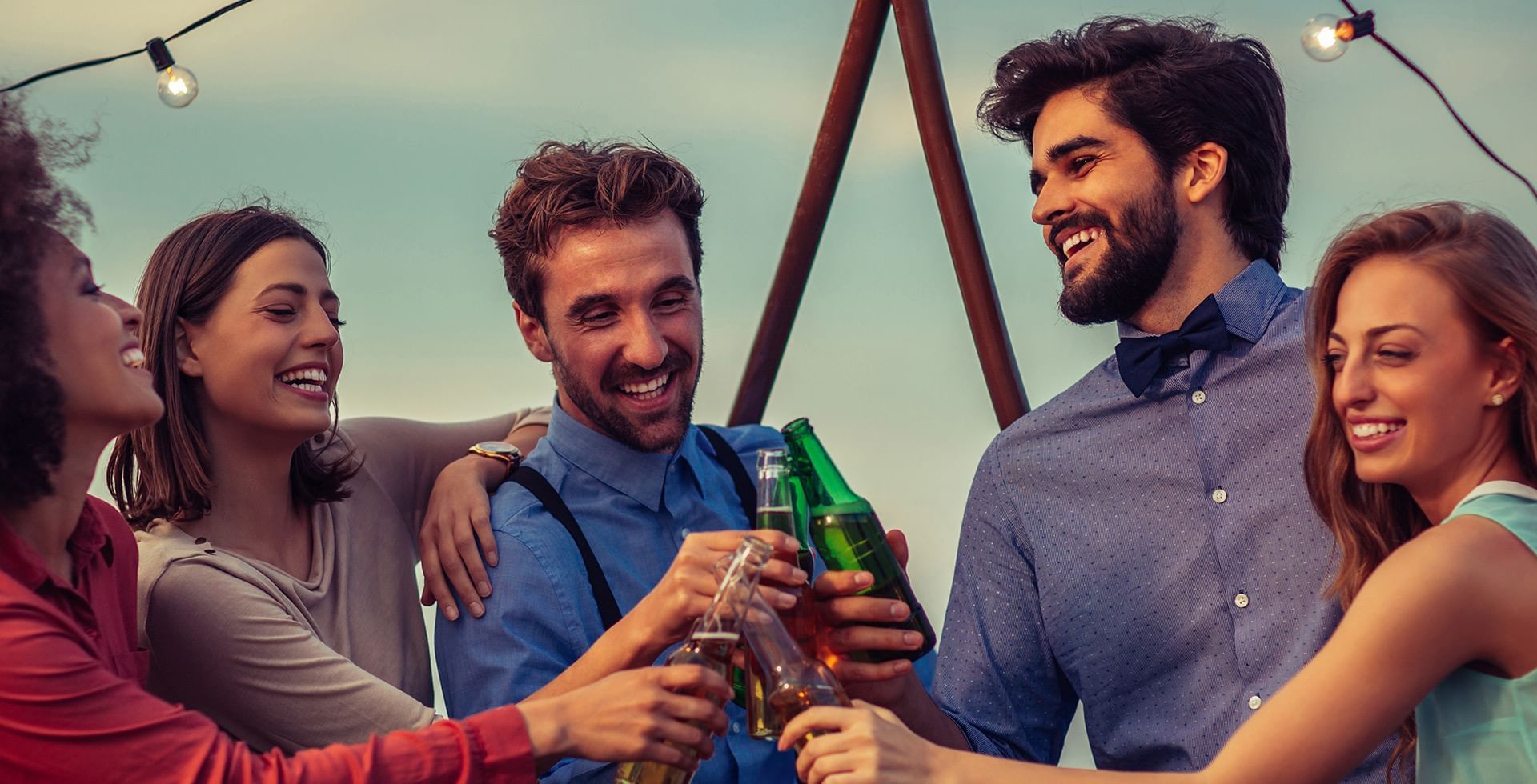 Group of friends having a toast at The Oceanside, a Coast Hotel