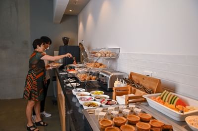 Guests serving by the buffet at Nesuto Curtin Perth Hotel