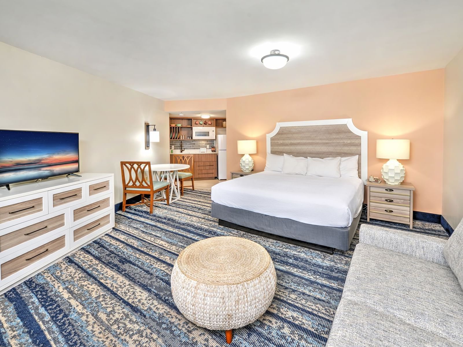 Spacious Ocean View King room with kitchenette at Bahama House Daytona Beach.