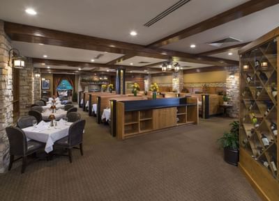 Ruth's Chris Steak House interior with arranged dining table and wine display at Hotel Park City Autograph Collection
