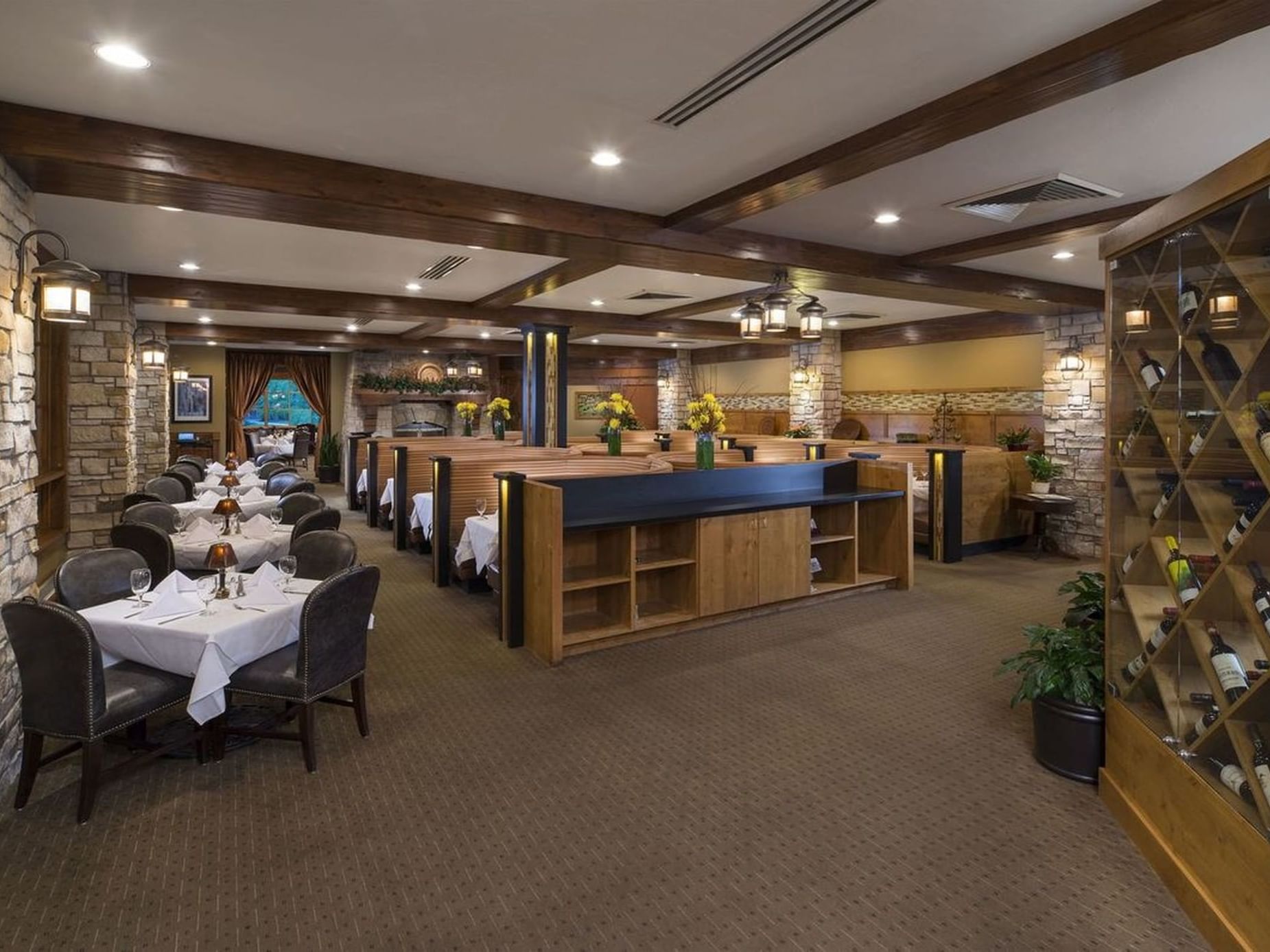 Ruth's Chris Steak House interior with arranged dining table and wine display at Hotel Park City Autograph Collection