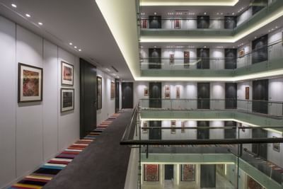 Staircase view from the second floor corridor at Eastin Residences Vadodara