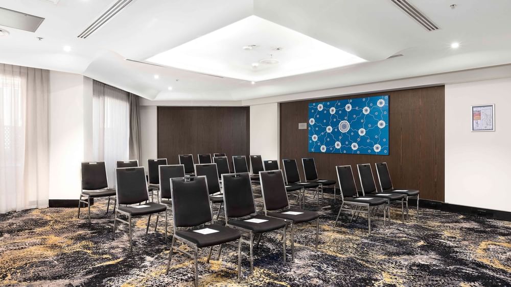 Theatre set-up with carpeted floors in The Yarra Room at Novotel Sydney on Darling Harbour