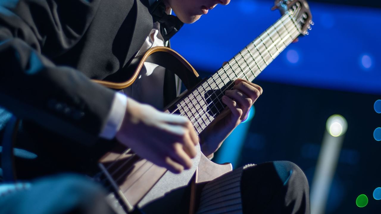 man playing a guitar