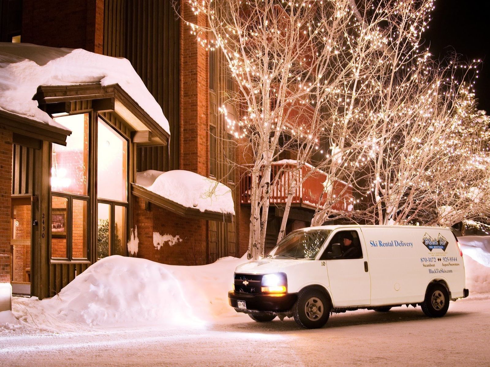 A van parked in front of hotel entrance at Alpenhof Lodge