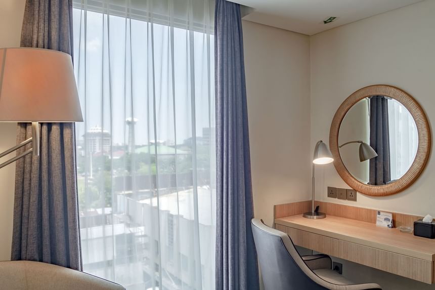 Mirror table and city view in Deluxe King Bed Room at LK Hotel Simpang Lima
