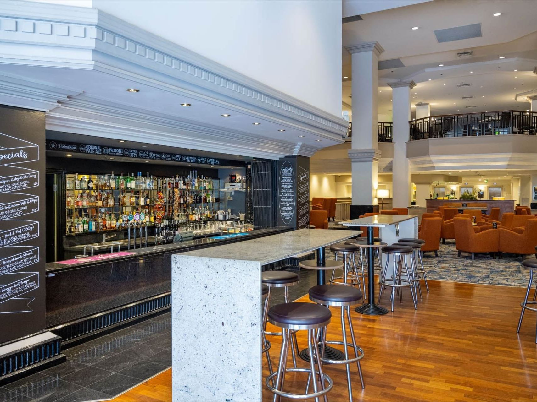 Wooden floors & lounge area in Sebastyan's Bar at Grand Chancellor Adelaide
