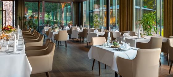 Interior of a dining area with glass walls at Ana Hotels