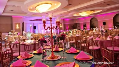 banquet hall with decorated tables and lighting