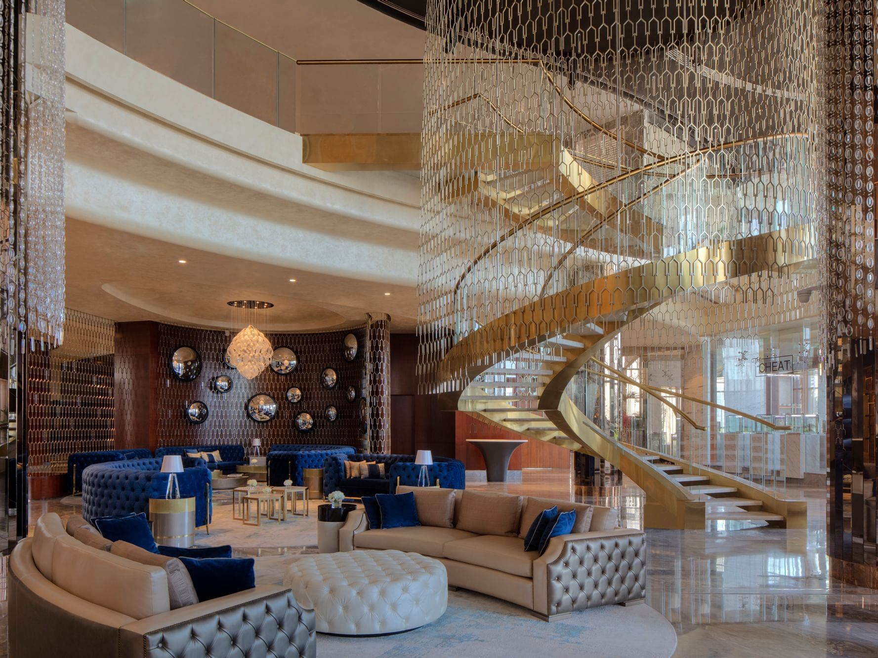 Grand Lobby with seating and chandeliers at Paramount Hotel Dubai